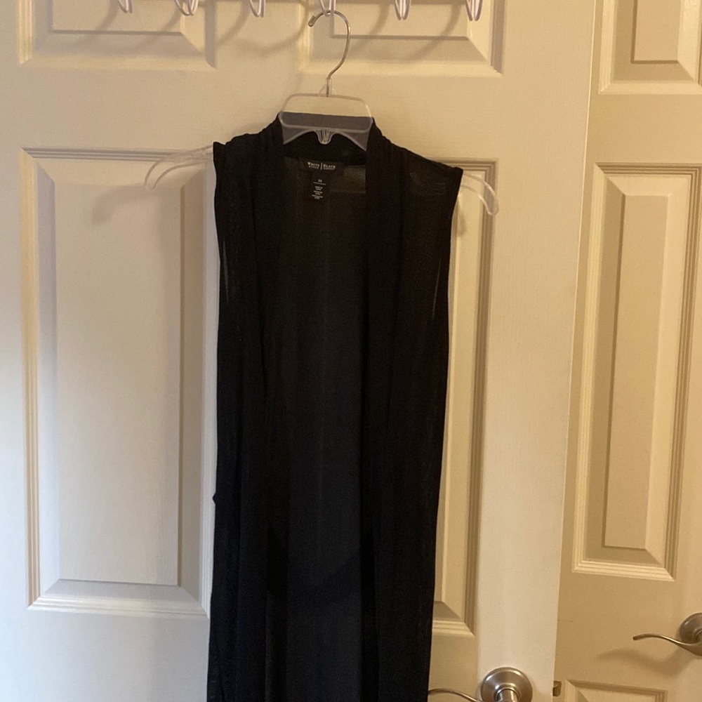Sleeveless black cardigan. 3/4 length